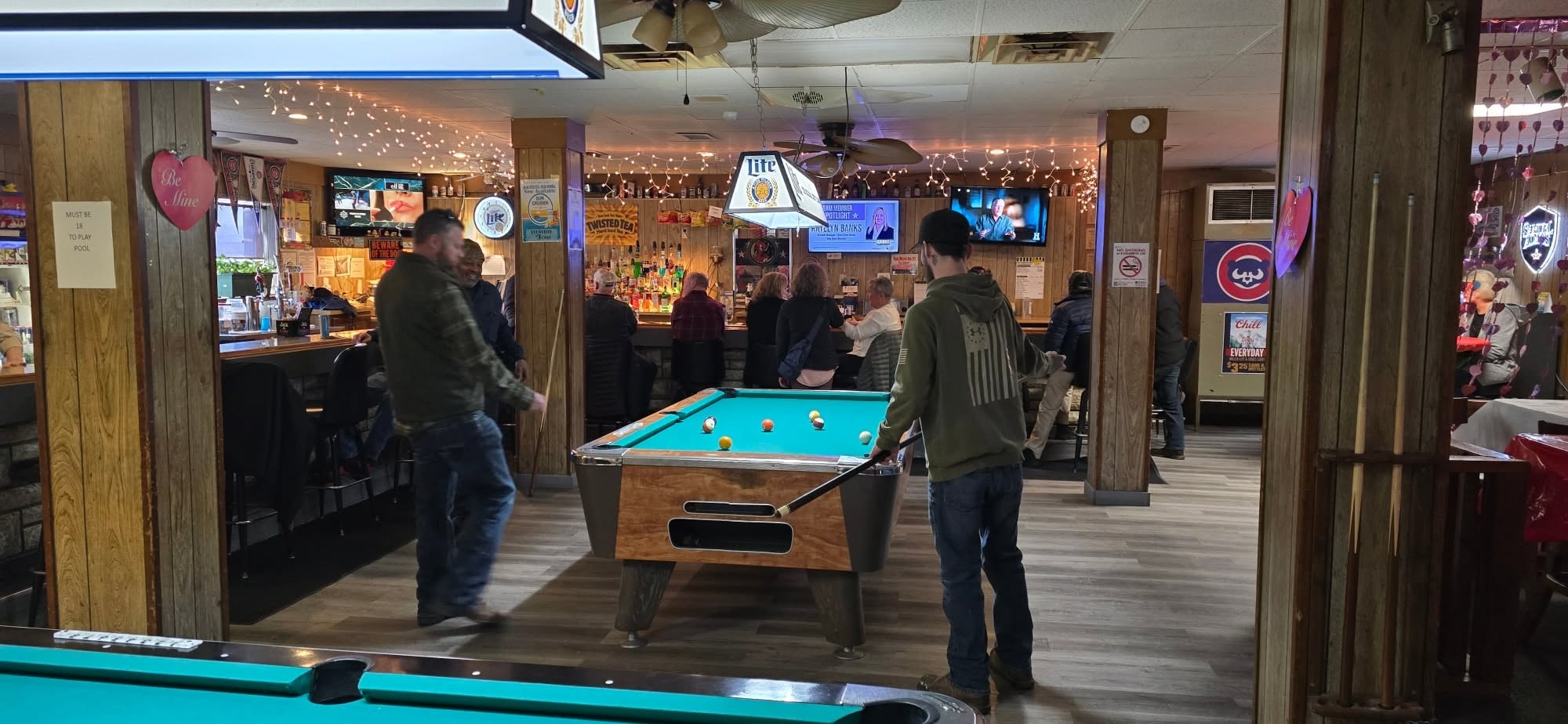 Placeholder for a photo of members at the bar